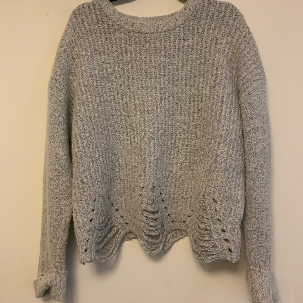 Cute grey knit sweater with distressed bottom